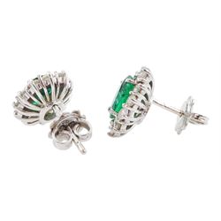 Pair of 18ct white gold oval cut emerald and round brilliant cut diamond cluster stud earrings, hallmarked, total emerald weight approx 2.00 carat, total diamond weight approx 1.20 carat