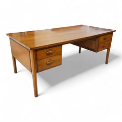 Possibly Heals of London - mid-20th century walnut kneehole desk, rectangular top over four drawers, on tapering supports 