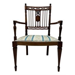 Edwardian inlaid rosewood elbow chair, pierced cresting rail over carved ribbon tie and oval inlaid panel, upholstered in stripe and floral pattern fabric, on square tapering supports with spade feet 