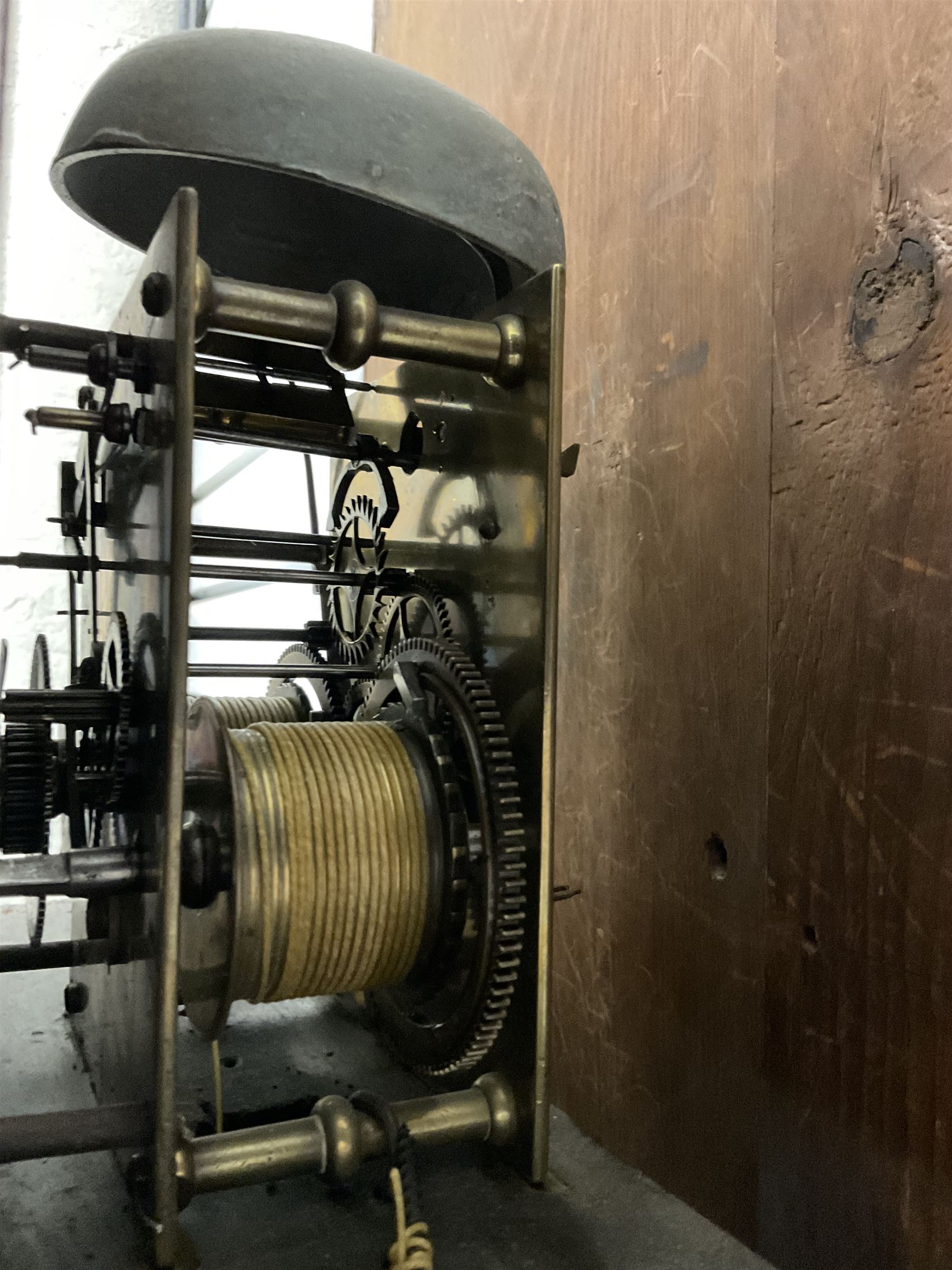 Late 19th century - oak and mahogany 8-day longcase clock, with a swan necked pediment, break arch hood door beneath flanked by ring turned pilasters, trunk with canted corners and a short wavy topped door, on a reduced plinth with no feet, painted dial with a depiction of a huntsman to the arch and game to the spandrels, with brass hands, Roman numerals and matching seconds and date dials, dial pinned directly to a rack striking movement, striking the hours on a bell. With pendulum and two weighs 