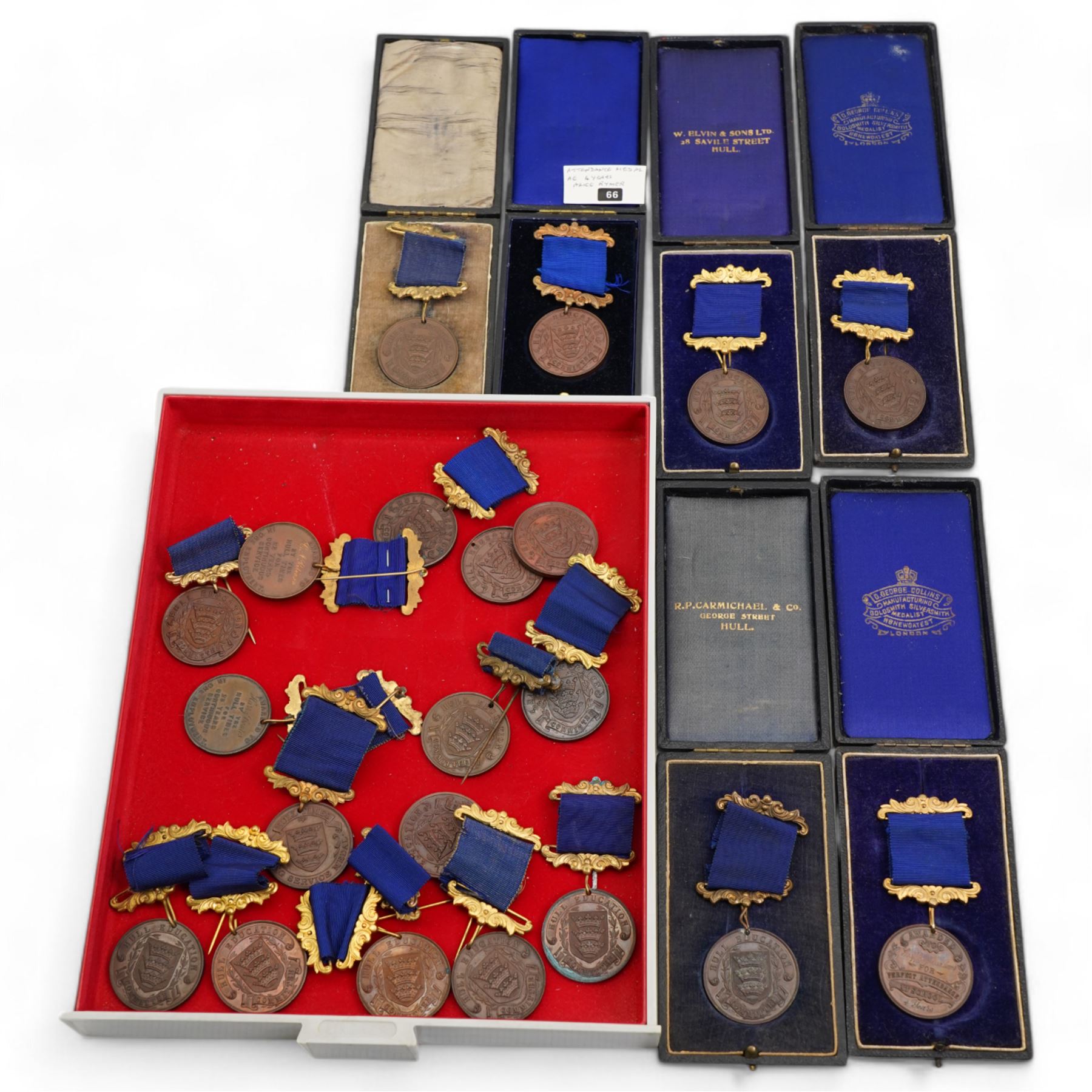 Eighteen Hull Education Committee 'Perfect Attendance At School' medallions, six cased and three Hull Times Long Service Medals 'For 25 Years Continuous Service', housed in a Lindner tray