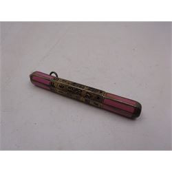 1920s silver and enamel calendar pencil, the silver faceted body decorated with panels of pink enamel with central adjustable calendar to centre, set with purple polished stone to one end, with London import marks for 1927, Cohen & Charles, L6.5cm