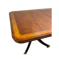 RBC Furniture (Made in England) - Georgian design mahogany dining table, rectangular top with rounded corners, satinwood and burr walnut bandings, two D-ends with two additional leaves and support rails, on barrel turned pedestals with four out-splayed reeded supports, brass cups and castors 