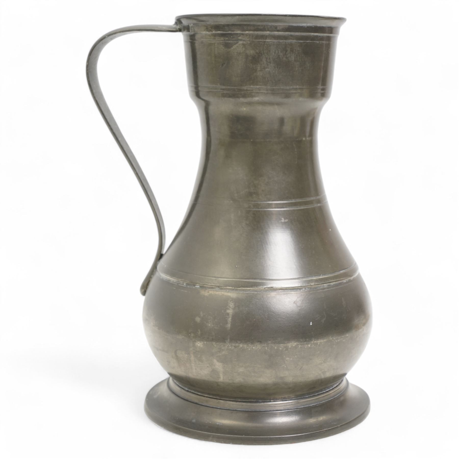 18th century large pewter measure, circa 1795, with strap handle, touch marks at the rim and base, H22cm