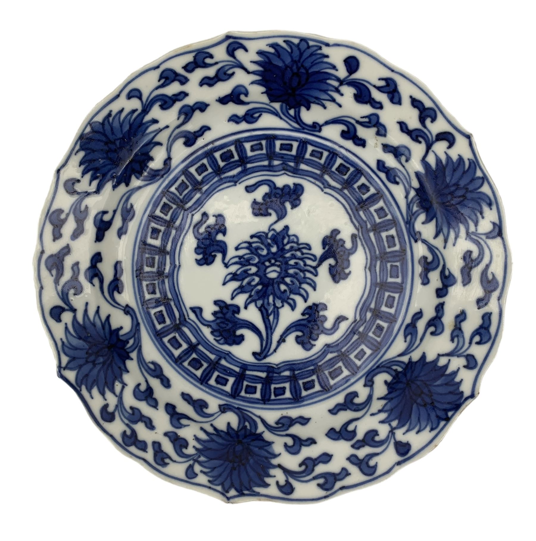 19th century Chinese blue and white saucer dish decorated in the Long Eliza pattern, four character mark within double circle beneath, D13.5cm, and a Chinese shaped dish painted with lotus flowers, provincial shop mark within square border beneath (2)