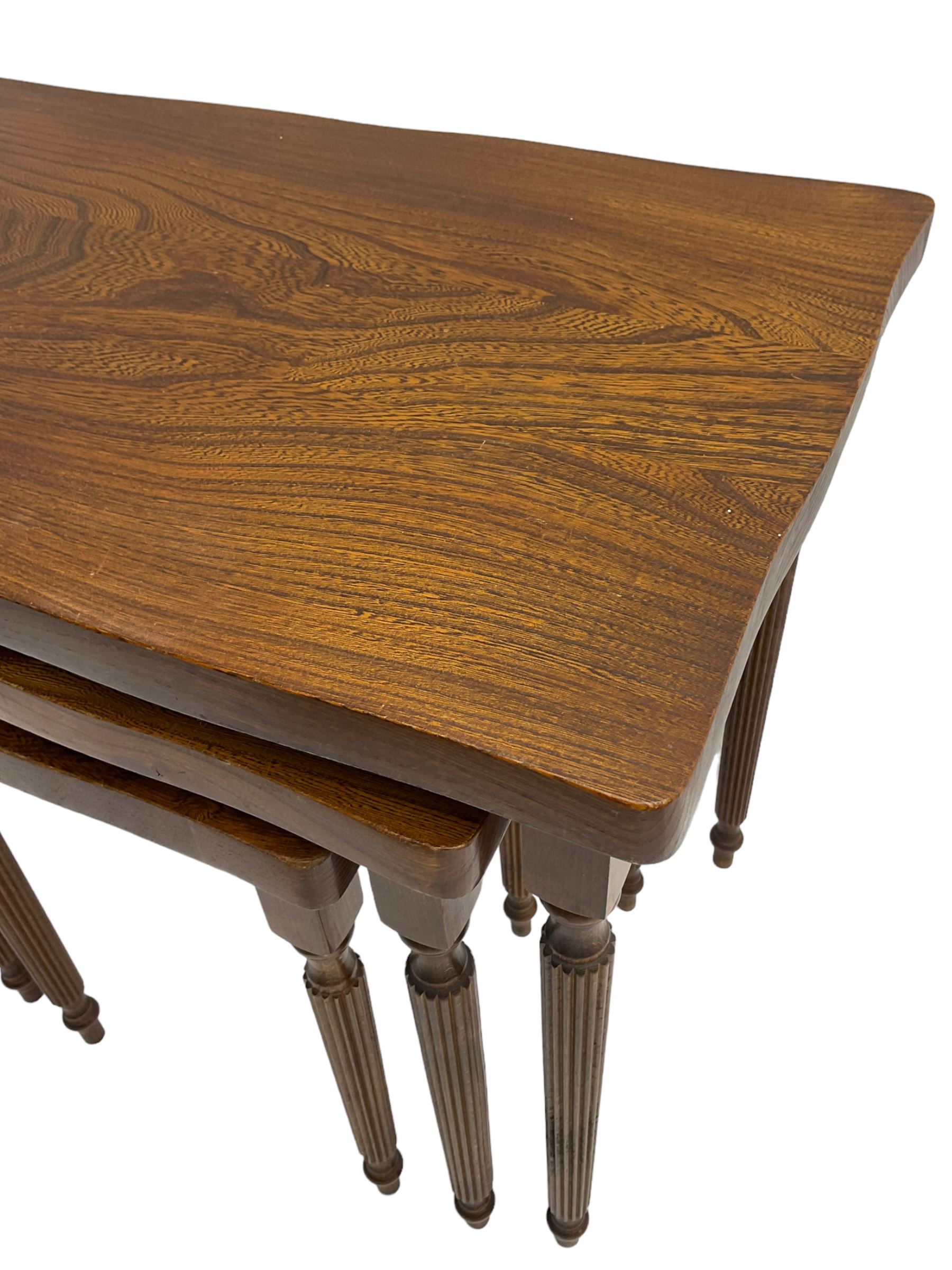 19th century design elm nest of three tables, rectangular shaped top, raised on tapering reeded supports 