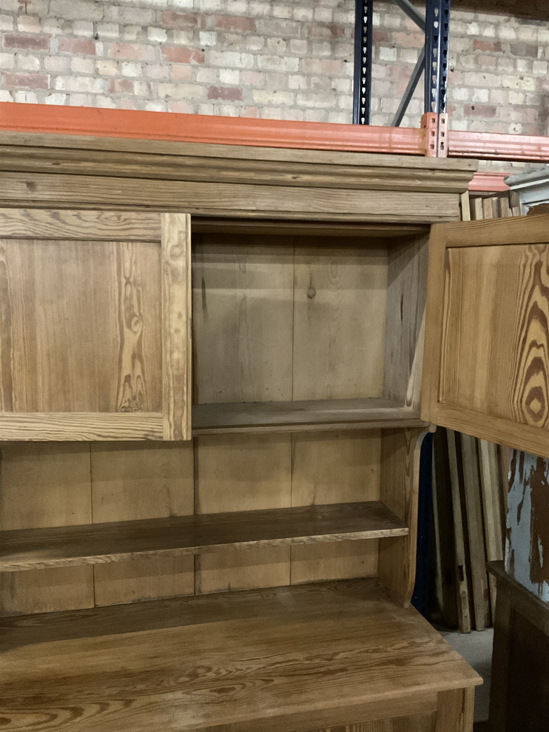 Late Victorian pitch pine dresser, moulded cornice over raised panelled cupboard and shelf, rectangular top over double panelled cupboard, on skirted base - THIS LOT IS TO BE COLLECTED BY APPOINTMENT FROM THE OLD BUFFER DEPOT, MELBOURNE PLACE, SOWERBY, THIRSK, YO7 1QY