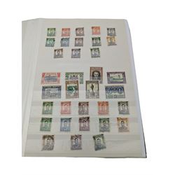 Mostly Commonwealth or Empire stamps including Queen Elizabeth II Northern Rhodesia, Nyasaland, Solomon Islands, Aden, Bermuda, Grenada 'Associated Statehood' overprints, King George VI Falkland Islands Dependencies with values to one shilling etc, mixture of mint and used, housed in a green stockbook