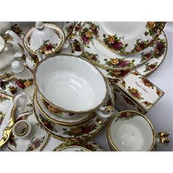 Royal Albert Old Country Roses pattern coffee service for six, comprising coffee pot, milk jug, cups and saucers, cake plate, together with miniature teapot, six teacups and saucers, six dinner plates, six side plates etc 