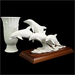 Kaiser limited edition porcelain group of four bottlenose dolphins on wooden stand No.306/4500 with incised signature W40cm and a Kaiser vase No.618 with incised signature to base H28cm (2)