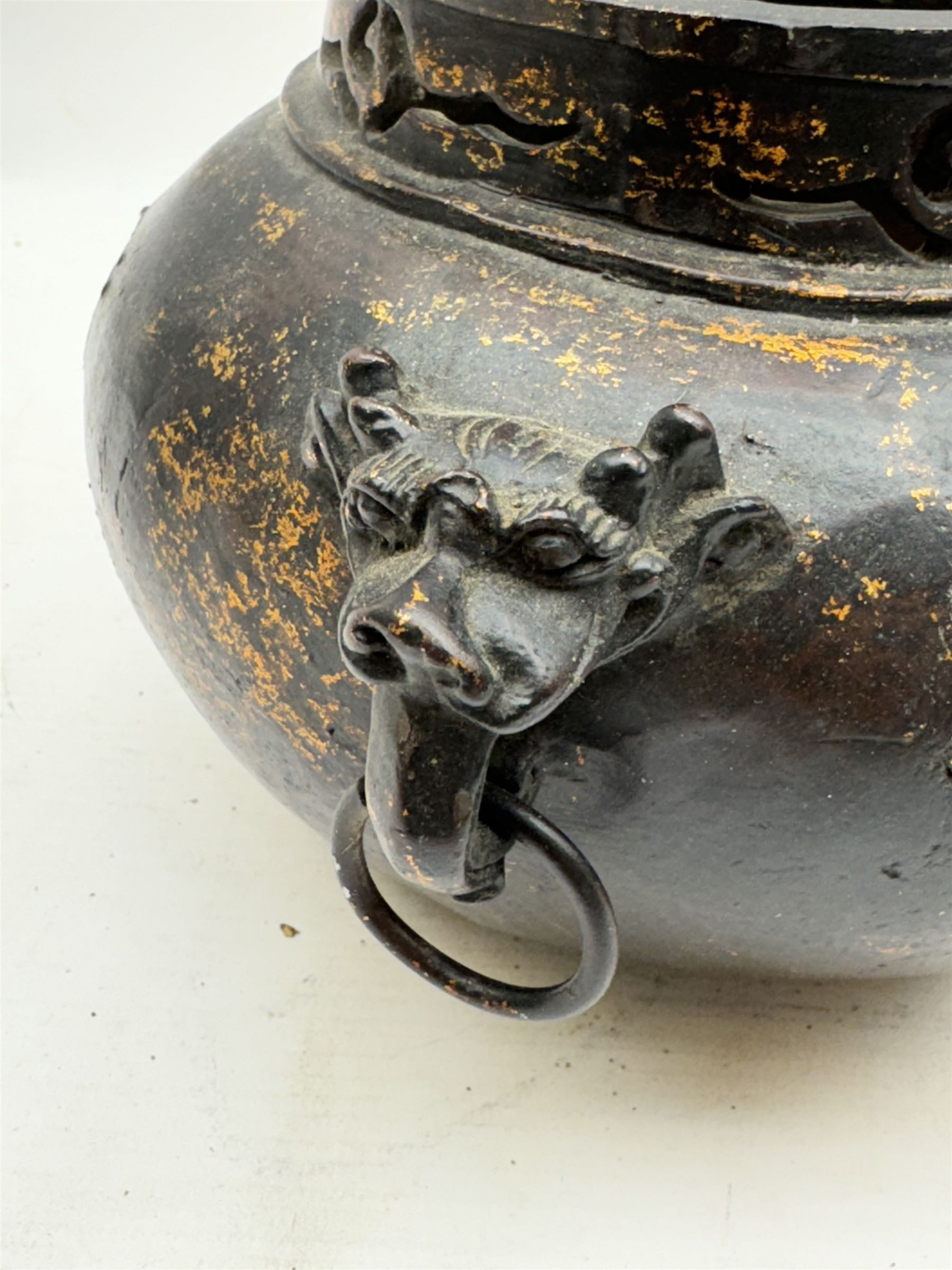 Chinese bronze incense burner, of squat form with mask and tongue handles, H15cm