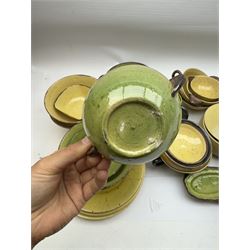 French green and yellow glazed tea and dinner wares by Etienne Noel, including milk jugs, teacups, side plates, bowls etc (43)