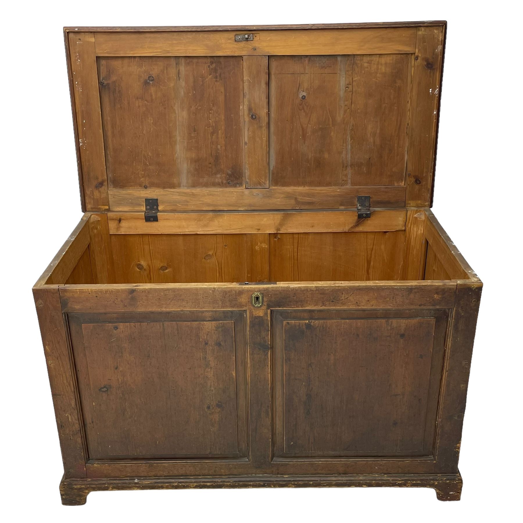 19th century pine blanket chest, double panelled hinged lid over panelled front and sides, on bracket feet