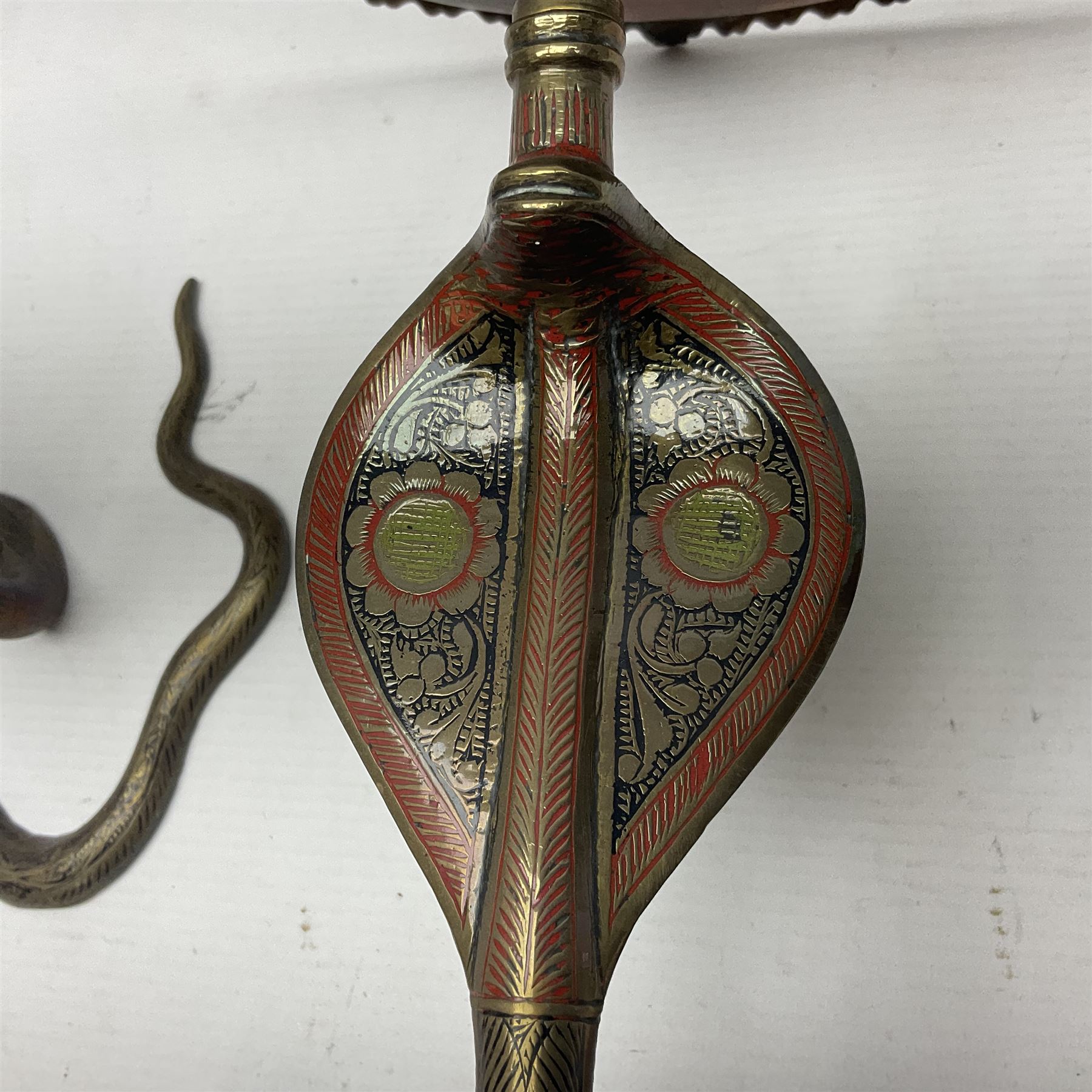 Indian brass pedestal dish, the dish engraved with peacock to centre, the stem modelled as a King Cobra, with engraved and enamelled decoration throughout, together with a similar pair of candlesticks, modelled as King Cobras, dish H23.5cm 