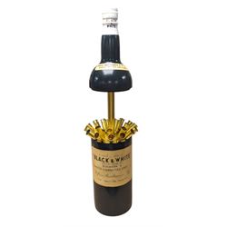 Novelty musical cigarette dispenser, in the form of a Black & White whisky bottle, H28cm