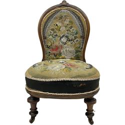 Early 20th century mahogany side chair, detailed marquetry frame, backrest with central urn motif and scrollwork inlay, arched crest rail with floral designs, cream and gold patterned fabric seat, turned front legs with brass castors (H78cm); Victorian walnut nursing chair, carved crest rail, floral needlepoint tapestry upholstery, turned front legs with ceramic castors (H81cm)