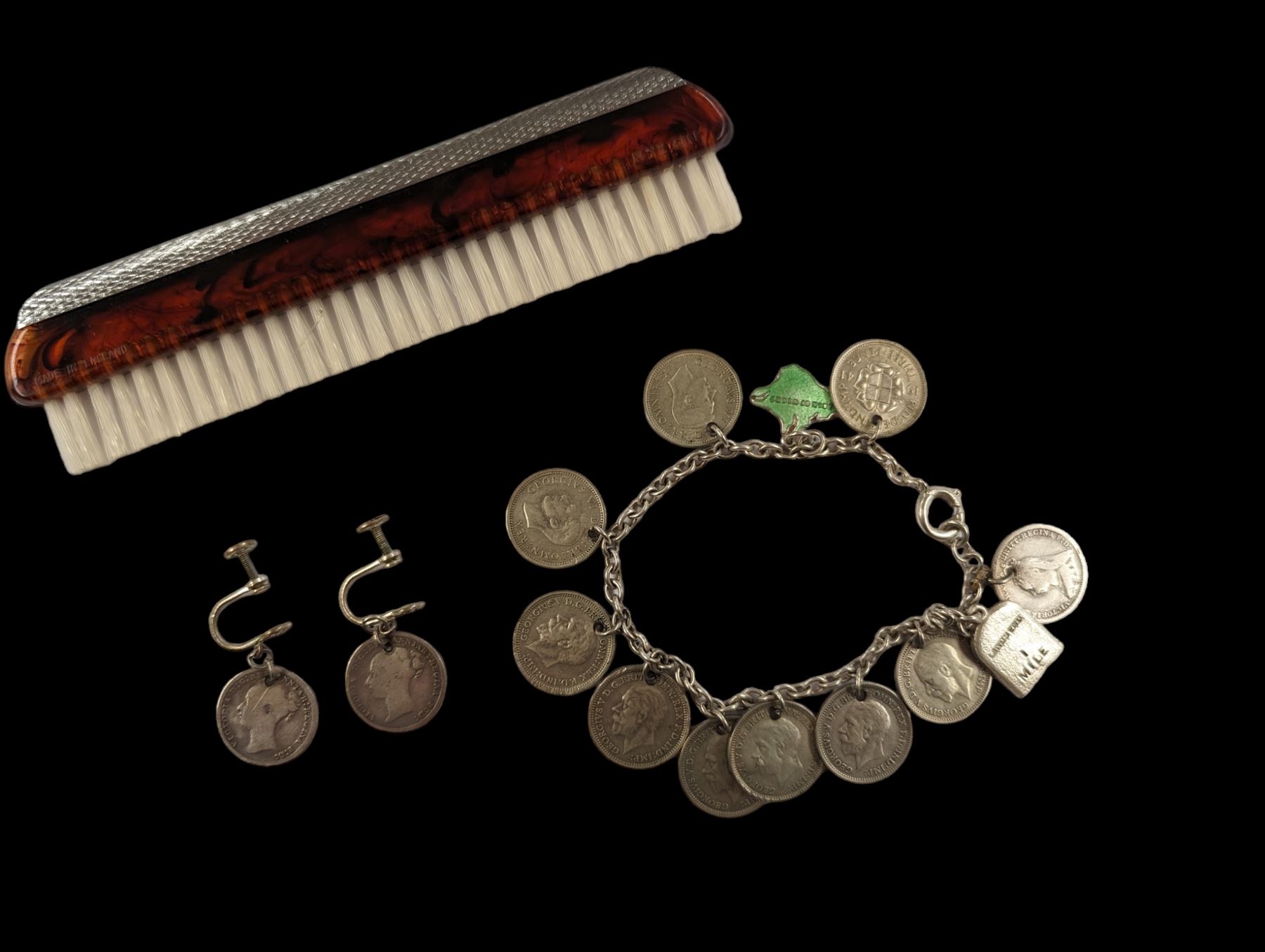 Coin charm bracelet, with mainly silver three pence coin charms, matching pair of earrings and a silver plate comb