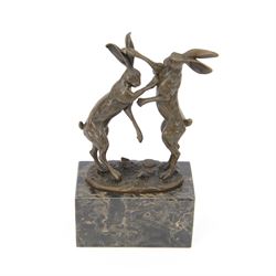 Bronze figure group, modelled as two male hares boxing, raised upon marble plinth base, wi...