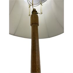 Mouseman - oak standard lamp, octagonal tapered stem on stepped and moulded octagonal base, carved with mouse signature, by the workshop of Robert Thompson, Kilburm 