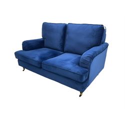 Howard design - two-seat sofa upholstered in blue fabric, traditional shape with rolled arms, on walnut finish turned feet with brushed metal cups and castors