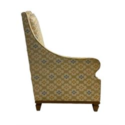 Spanish high back throne armchair, arched cresting rail over scooped arms, upholstered in gold and ivory patterned fabric, on a pitch pine base with spade feet