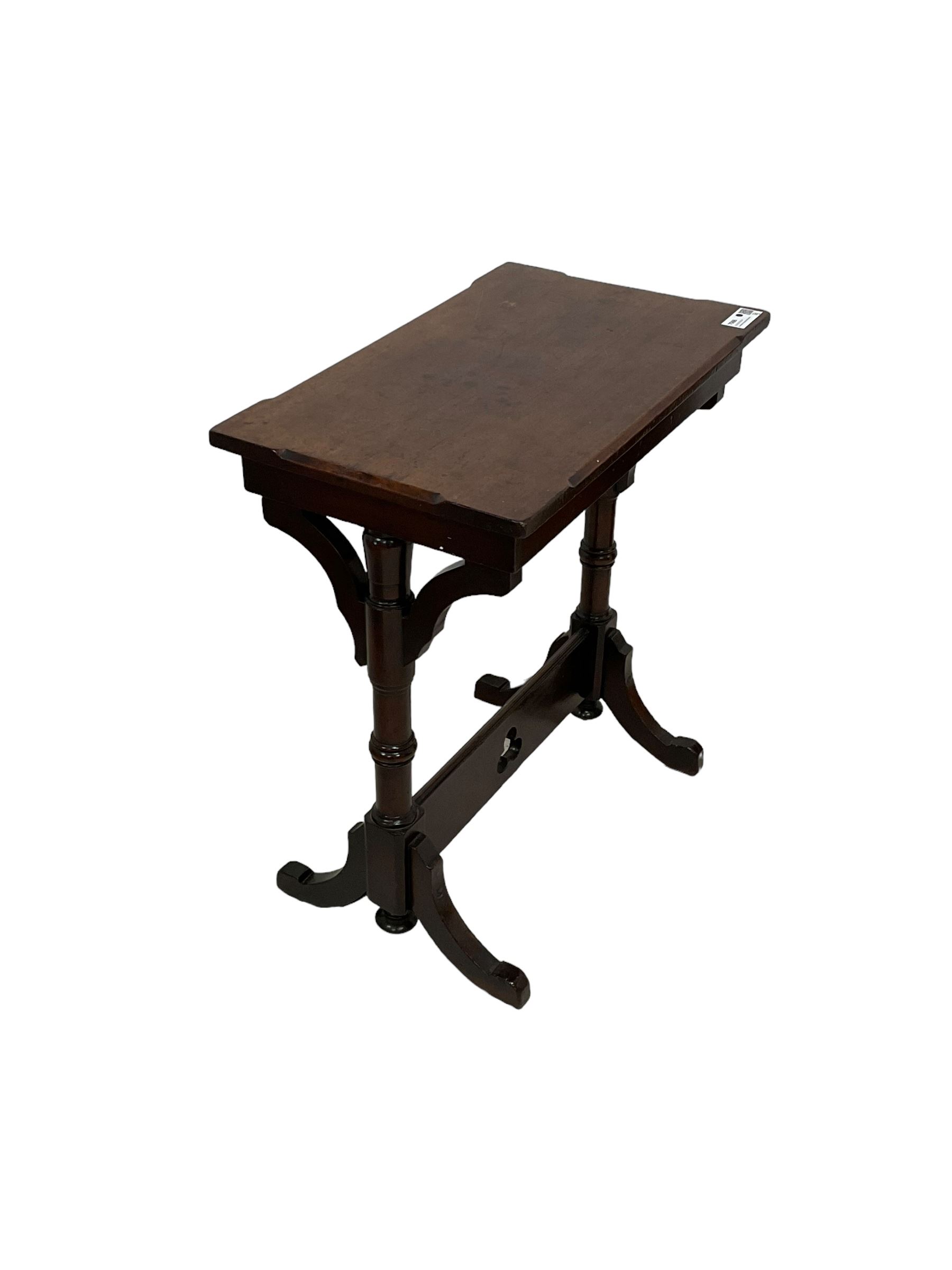 Late Victorian walnut ecclesiastical side table, rectangular top with stop chamfered edge, on turned supports united by rectangular stretcher pierced with trefoil, on splayed feet 