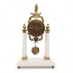 French - White marble and gilt 8-day mantel clock c1900,  with a rectangular plinth raised on four feet, gilt drum movement supported on four tapered pillars with gilt torus base and pineapple finials, convex enamel dial with floral swags and Arabic numerals, minute markers and gilt Louis XV hands, twin train Parisian countwheel striking movement, striking the hours and half-hours on a bell. With a sunburst pendulum.