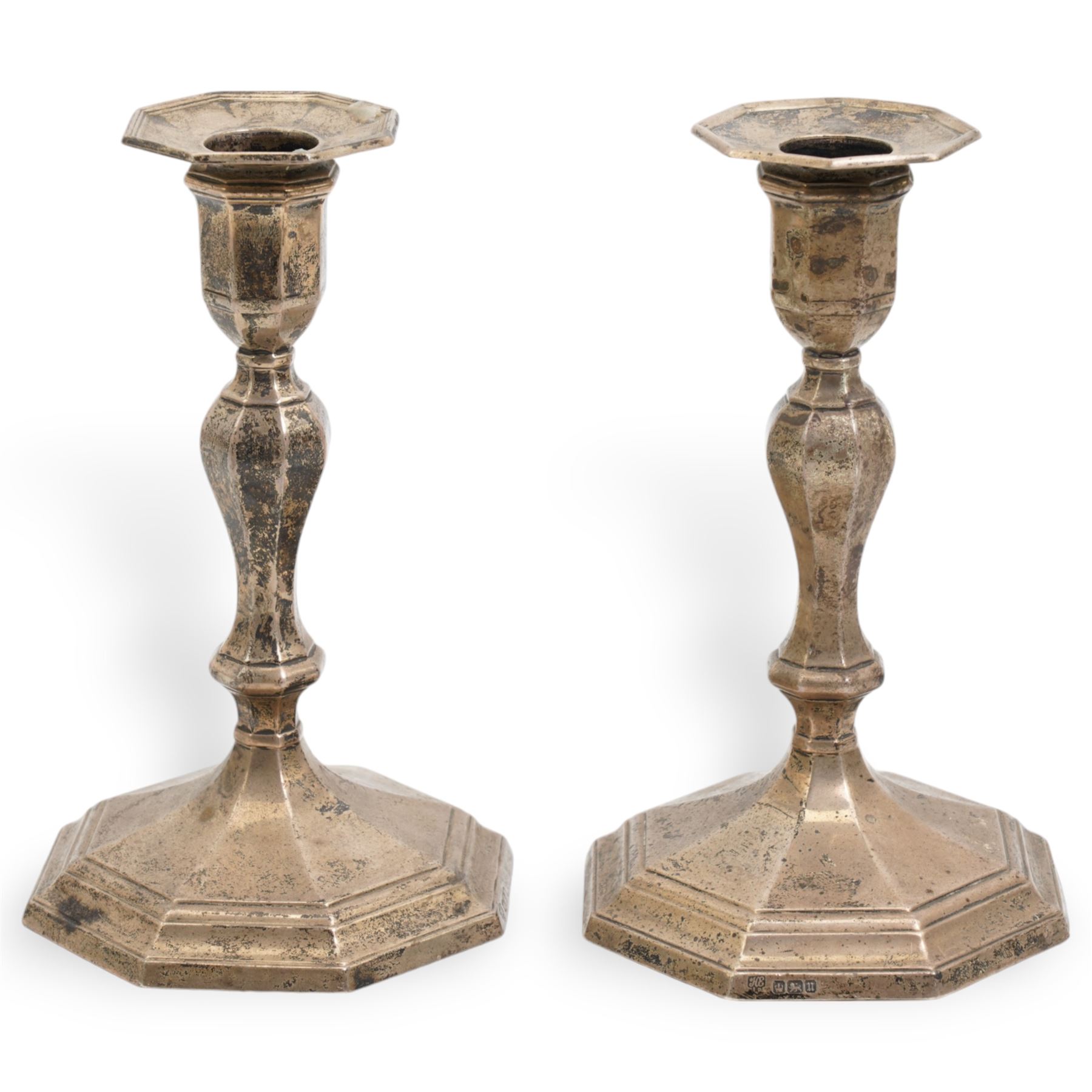 Pair of silver candlesticks with baluster stems and octagonal bases H17cm Sheffield 1912 Maker Hawksworth, Eyre & Co