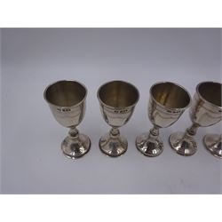 Set of six 1920s silver Kiddush cups, of goblet form with knopped stem, and engraved foliate detail, hallmarked London 1929, maker's mark M.S, H9cm