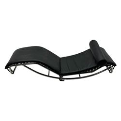 After Le Corbusier, Pierre Jeanneret, and Charlotte Perriand - LC4 chaise longue, black leather upholstery with cylindrical headrest, supported by a chromed tubular steel frame, with cantilever design with elastic webbing