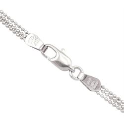 18ct white gold three strand bead necklace, stamped 750