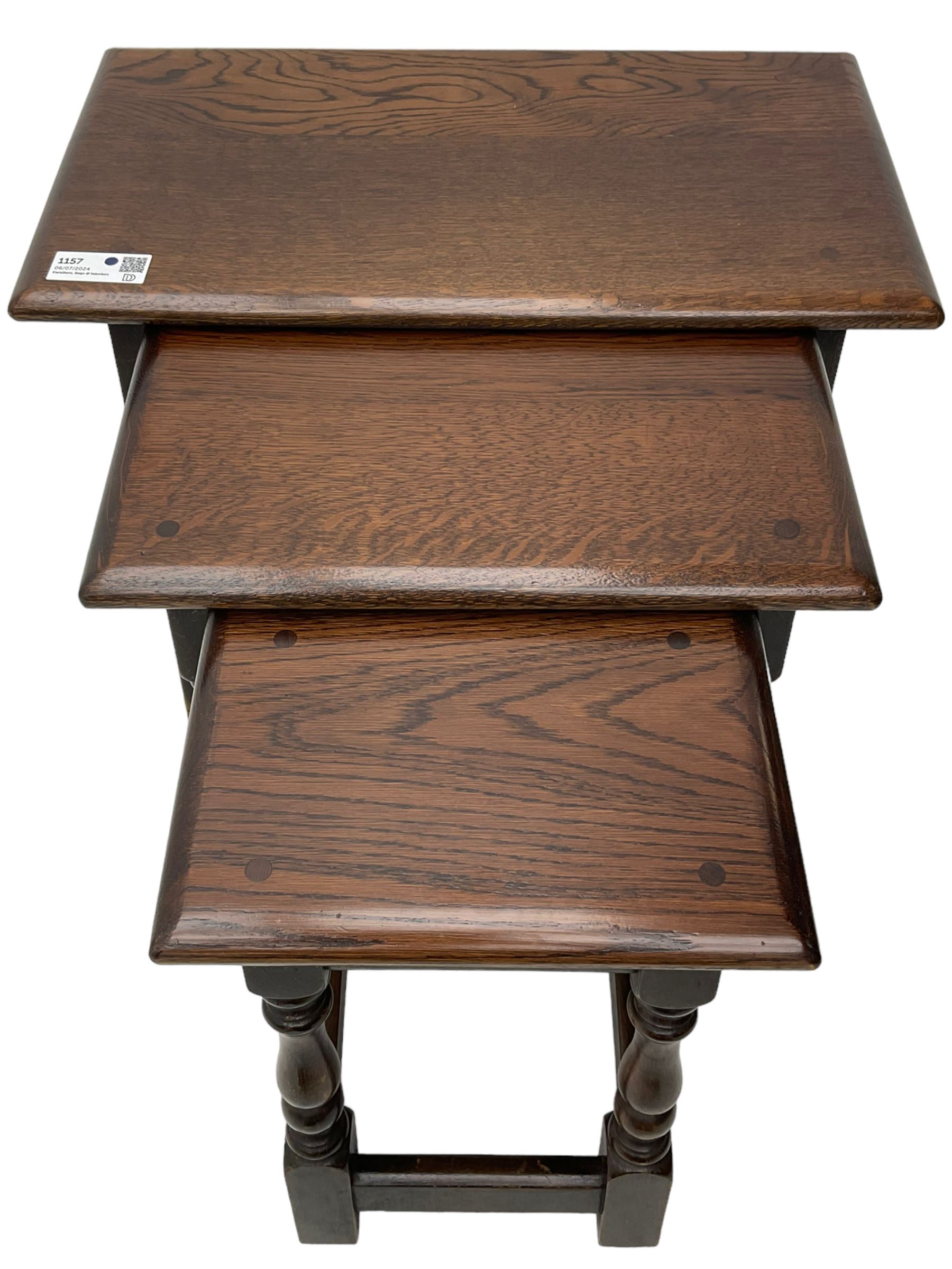 Mid-to-late 20th century medium oak nest of three occasional tables