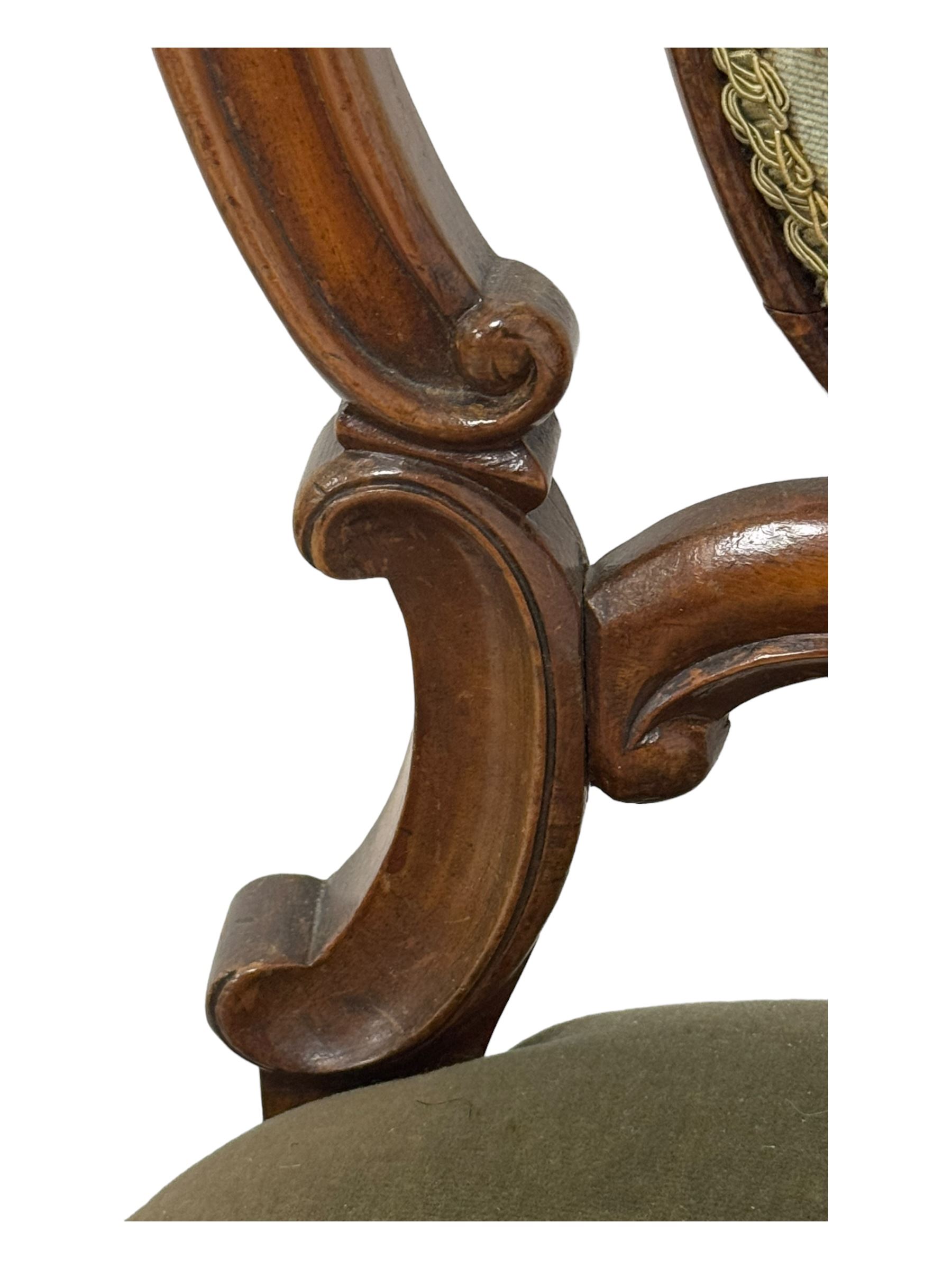 Pair of Victorian mahogany salon chairs, carved and pierced cameo back with scrolling acanthus leaf decoration and c-scrolls, upholstered in sage green fabric, on cabriole supports with floral mouldings