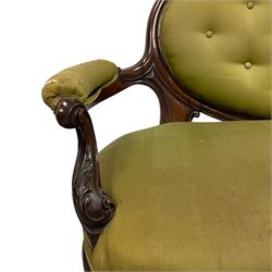 Victorian carved walnut framed two seat settee, cresting rail carved and moulded with a posy of roses and trailing foliate, over an oval back with scrolled arm terminals, serpentine fronted seat over cabriole supports with bell-flower carved knees, buttoned back and sprung seat upholstered in olive green fabric