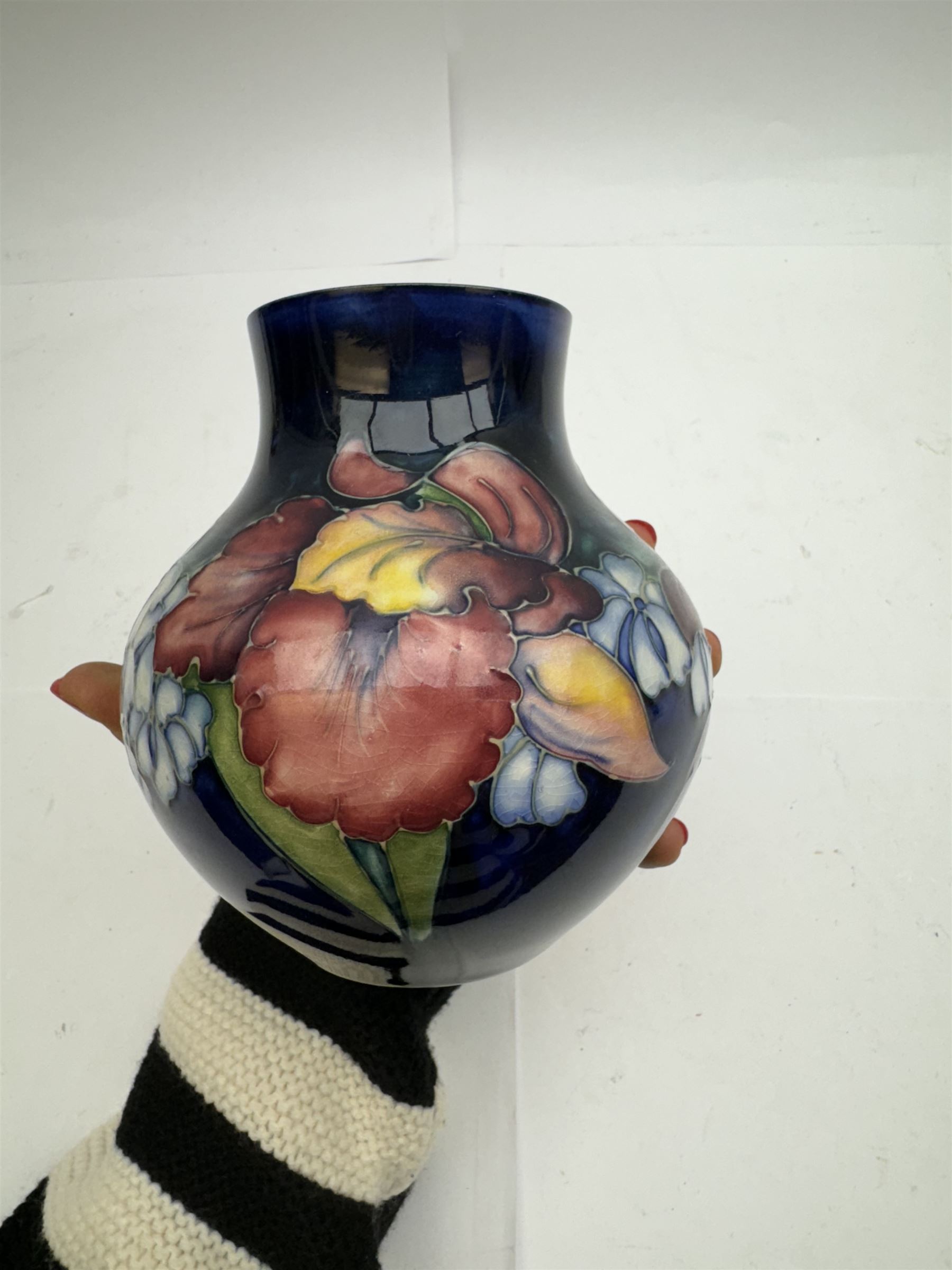 Moorcroft vase of squat baluster form in Orchid pattern H14cm