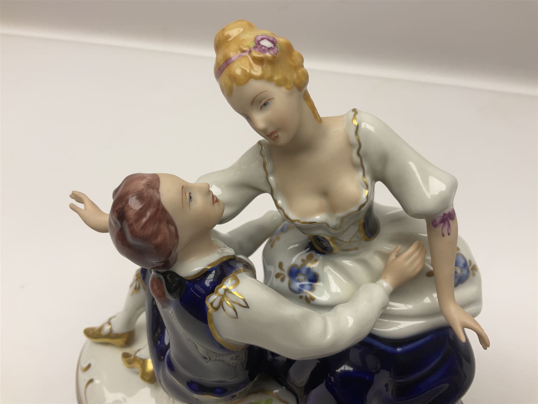 Two Royal Worcester figures, comprising Spirit of the Millennium and Spring, together with Royal Dux figure of two lovers