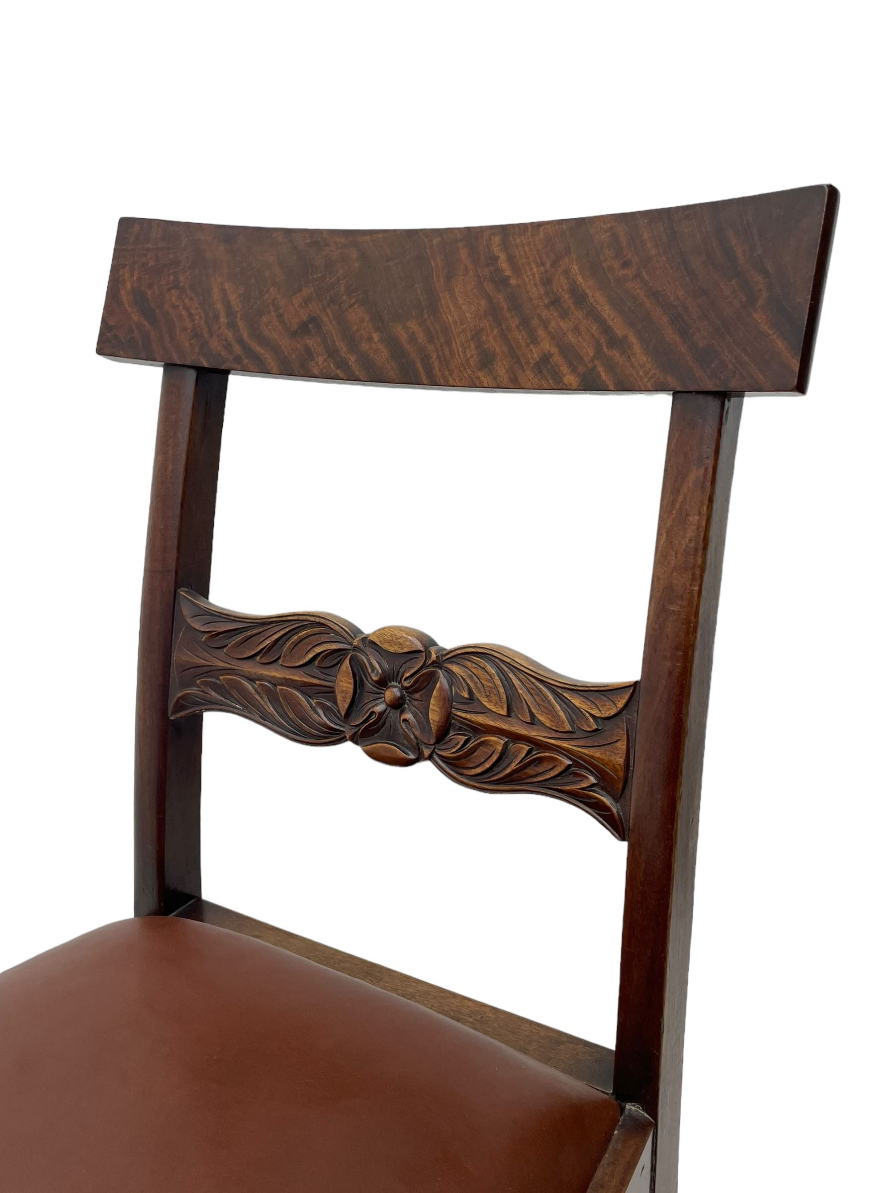 Set of six (4+2) early 19th century mahogany dining chairs, figured bar back over rose and curled leaf carved middle rail, drop-in seats upholstered in brown fabric, on turned front supports 