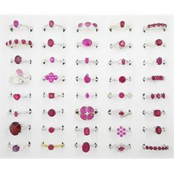 Forty silver stone set rings including mostly ruby, some set with white zircon