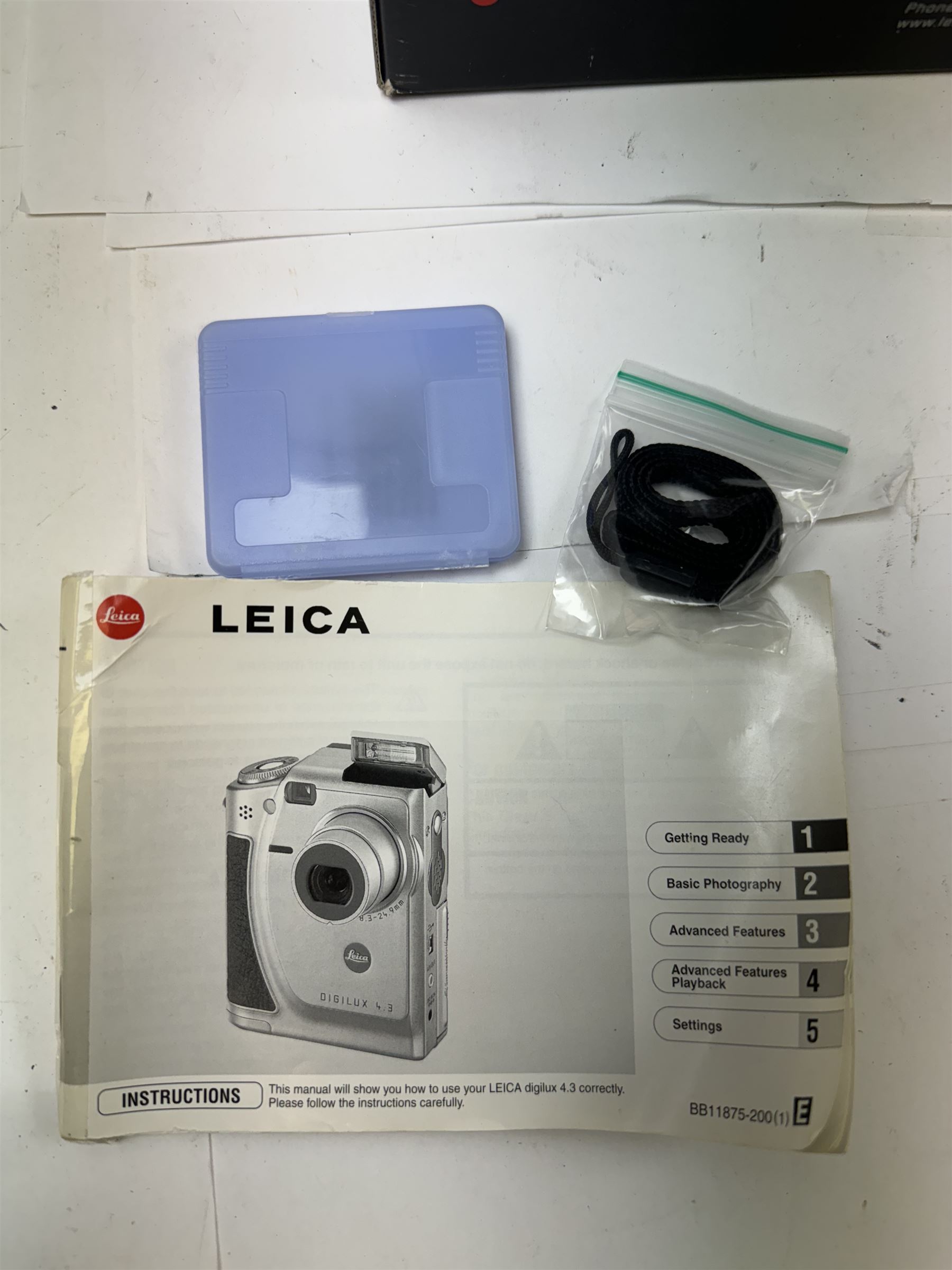 Leica C11 APS film compact camera, in silver and chrome finish, serial no. 2636834, in original clear hard case and box, with instruction booklet, together with a Leica Digilux 4.3, with 1:2.8-4.5/8.3-24.9mm lens, serial no. 2598862, with instruction booklet