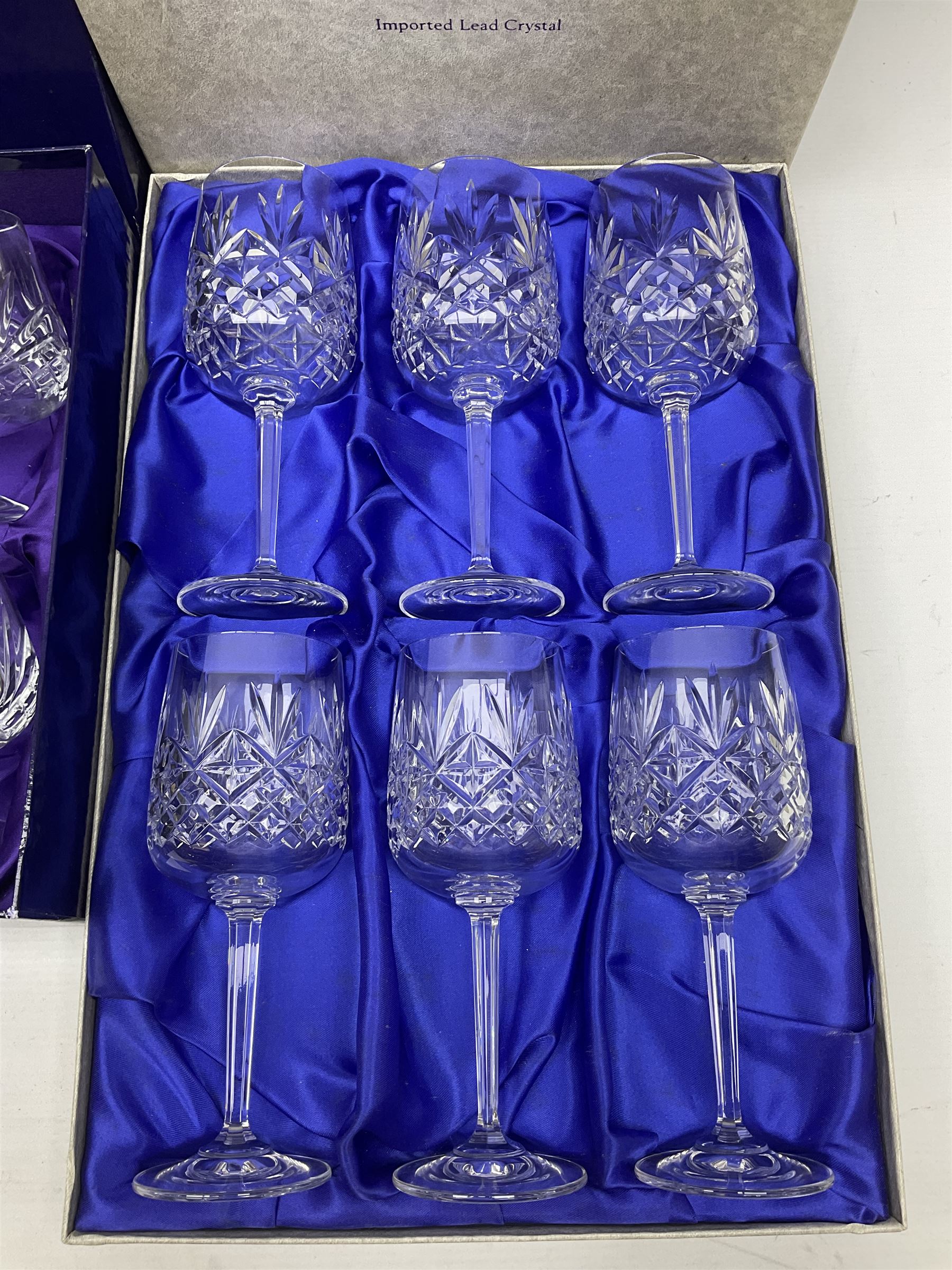 Set of six Edinburgh Crystal Continental Collection wine glasses, together with a set of six Edinburgh Crystal brandy glasses, both boxed