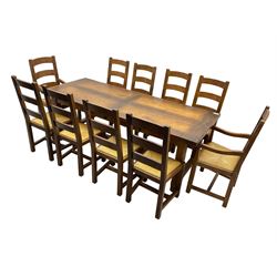 Antix Furniture - oak extending refectory dining table, rectangular plank top with two additional leaves and two drawers to the longer side, on square supports connected by H-stretcher; set of ten (8+2) ladder back dining chairs with rush seats