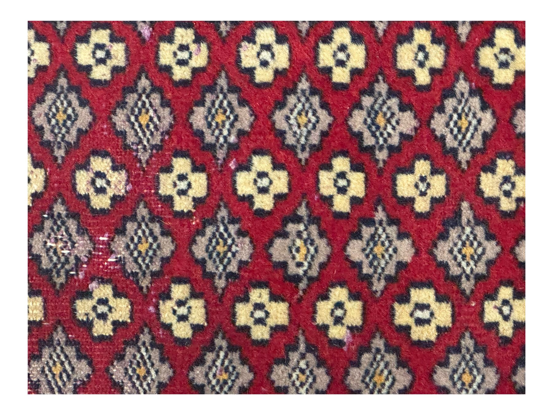 Pakistani Kashan hand-knotted rug with a central medallion and intricate geometric floral patterns, set against a red field and framed by a multi-band border; Pakistani Kashan rug with a repeating floral motif across the red field, enclosed by a detailed geometric border in complementary tones (2)