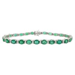 18ct white gold oval cut emerald and round brilliant cut diamond bracelet, stamped, total ...