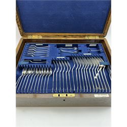 Walker & Hall canteen of plated cutlery for for twelve place settings, all knives with ivory effect handles, within an oak canteen case with a brass shield to the lid, with key, case  