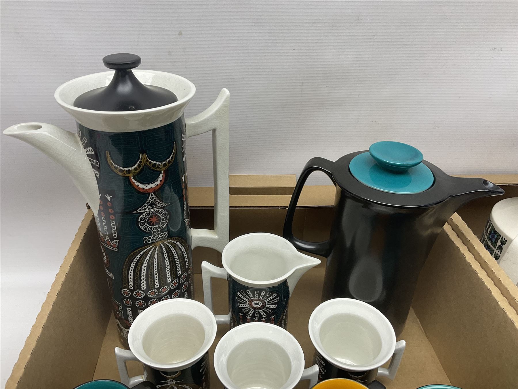 Portmeirion Magic City pattern coffee service for ten, together with Crown Devon Harlequin pattern coffee service for five and a Stafford Potteries Alton pattern coffee service for six