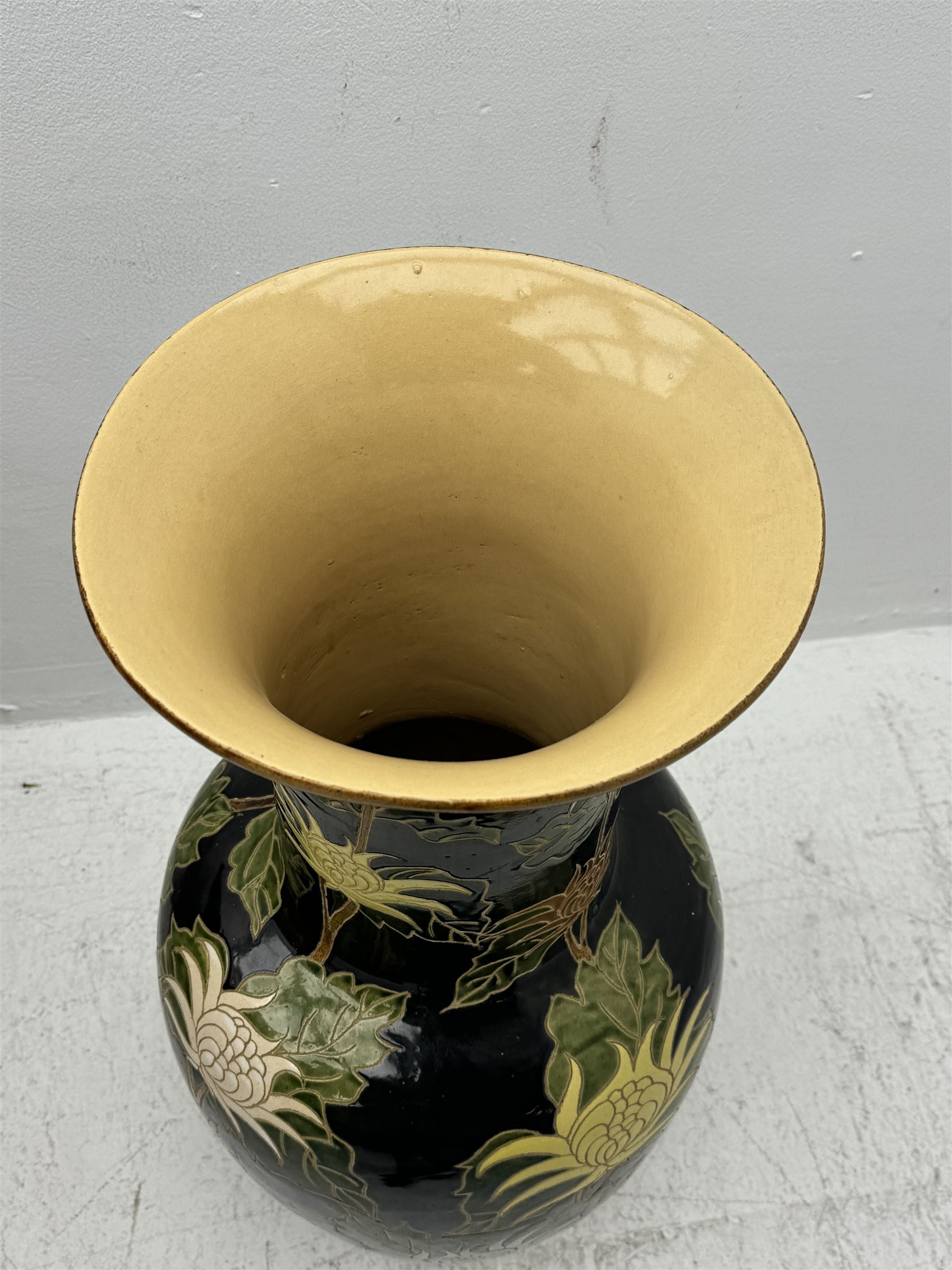 Floor vase with stylised flowers on a black ground, H84cm