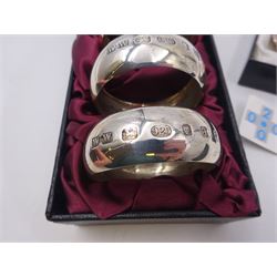 Set of six modern silver napkin rings, hallmarked London 2000, makers mark WW, together with a modern silver pin dish, hallmarked Hugh Crawshaw, Sheffield 2000, both boxed