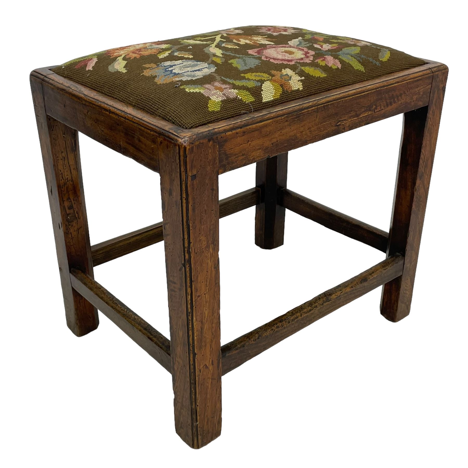 19th century country elm stool, rectangular form with drop-in seat upholstered in floral needlework, moulded frame and supports, united by plain stretchers 