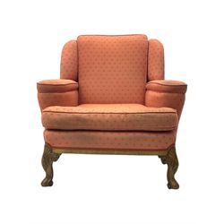 Late 20th century mahogany framed three seat sofa, upholstered in cream fabric with repeating cross pattern, raised on cabriole supports (W192cm, D98cm, H89cm); matching armchair in light pink fabric (W92cm, D98cm, H89cm) 