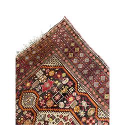 Persian Hamadan dark indigo ground rug, the field decorated with two connected pole medallions, decorated all over with small geometric and stylised bird motifs, geometric design border with repeating pattern 